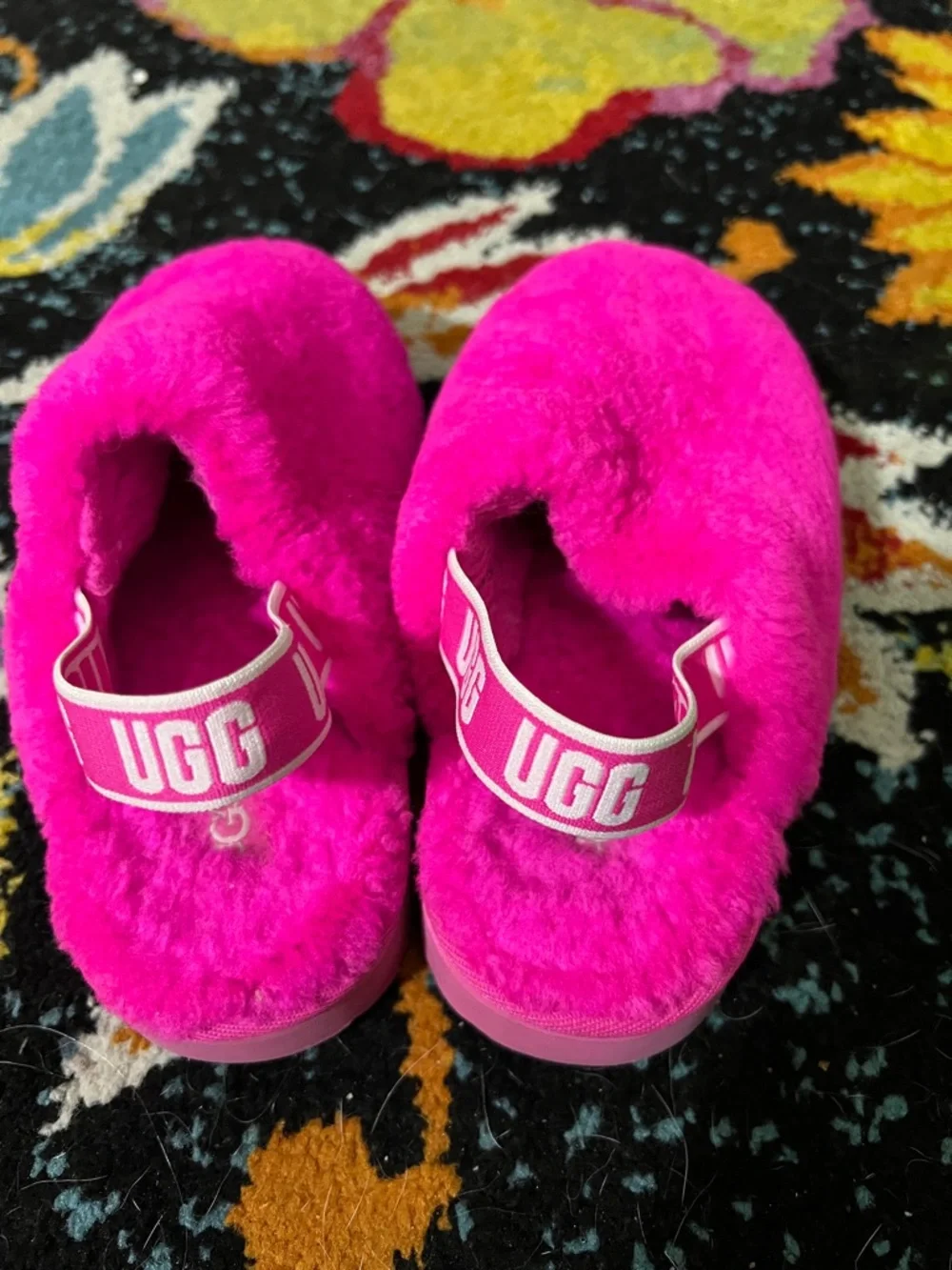 Pink fuzzy Ugg kids slip on